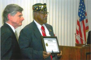 Ald. Jack Rose poses with UW Health and Wellness Management student, Herschel A. Ryales as he received the Kenosha Hometown Hero award in 2017.