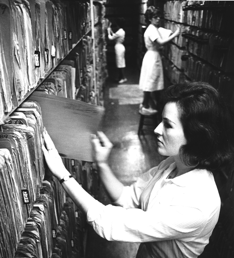 Women working in a paper chart room.