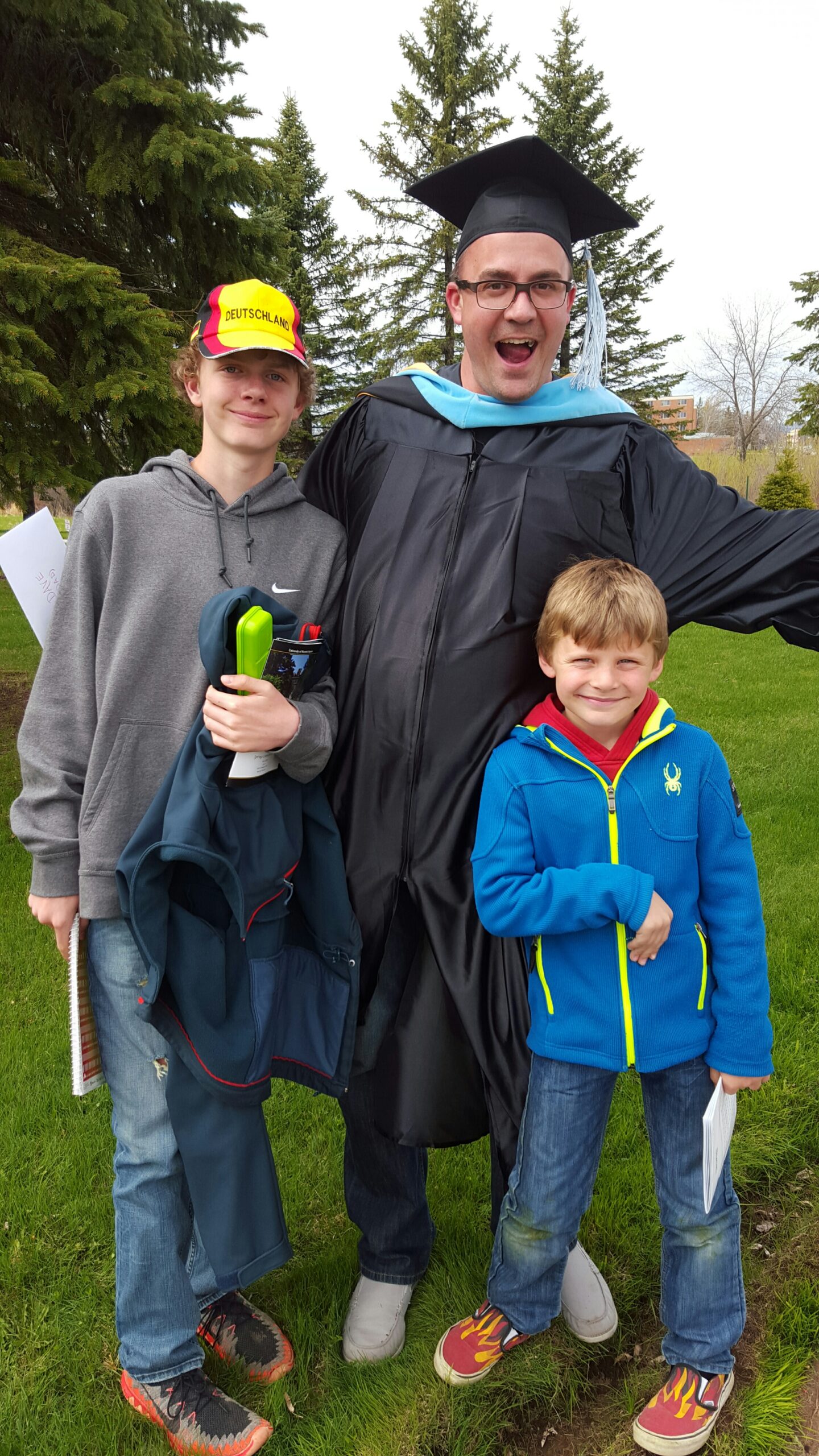 David Schneider, with his sons at graduation.