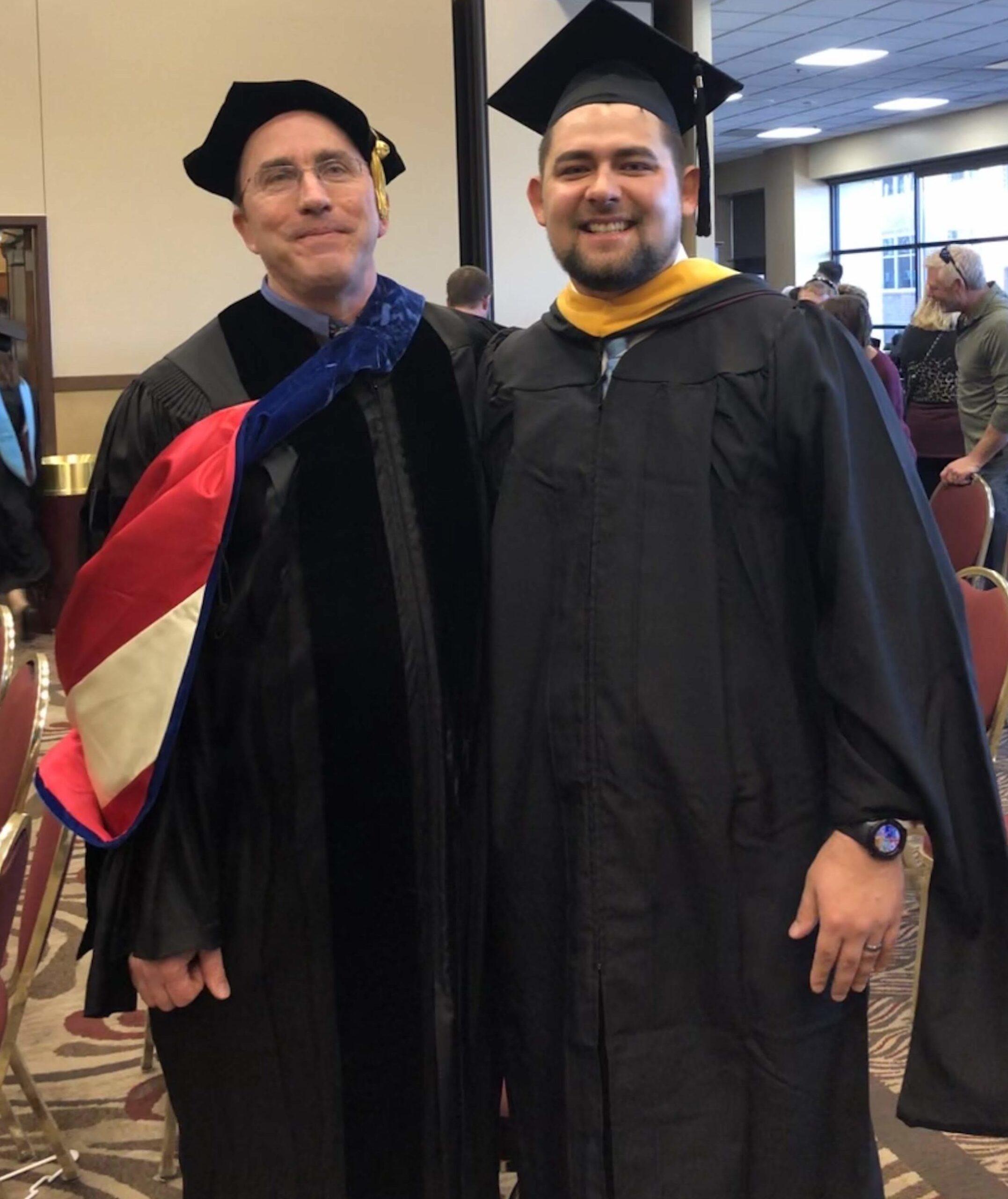 Lucas with Dr. Jeffrey Baggett at graduation in December 2018.