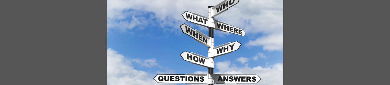 An image of a signpost labeled with "Who," "What," "Where," "When," "Why," and "How"