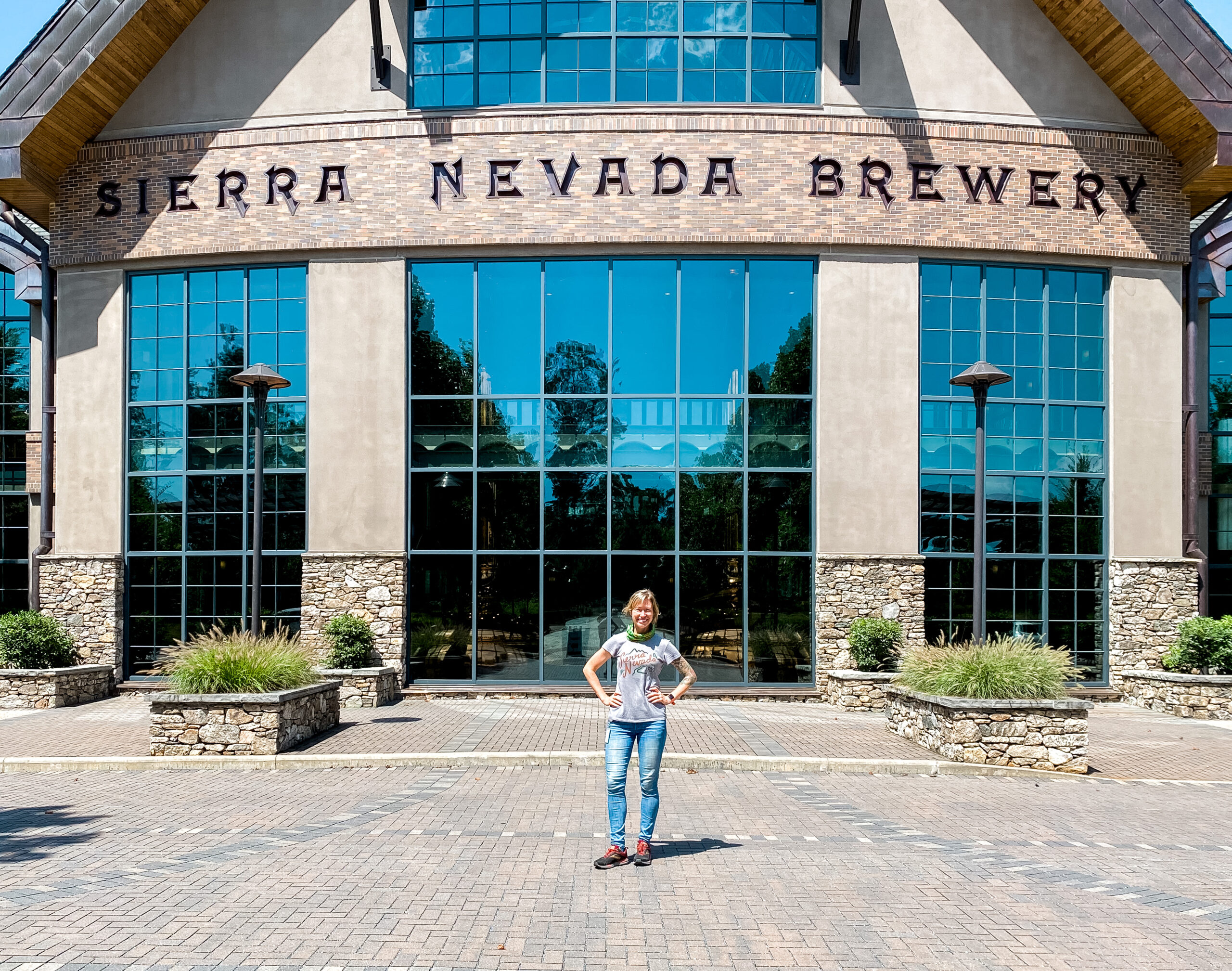 A photo of Amy Ebling standing outside the Sierra Nevada Brewing building.