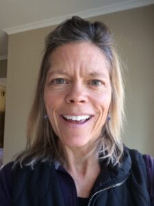 Headshot of Dr. Betsy Barrett smiling.