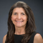 A professional headshot of Dr. Penny Lyter