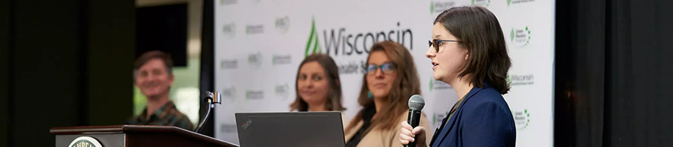 A photo of UW Sustainable Management alumni Karleen Kordas, Laura Loucks, and Carter O'Brien with program manager Amanda Goetsch presenting at the Wisconsin Sustainable Business Council 2022 Conference.