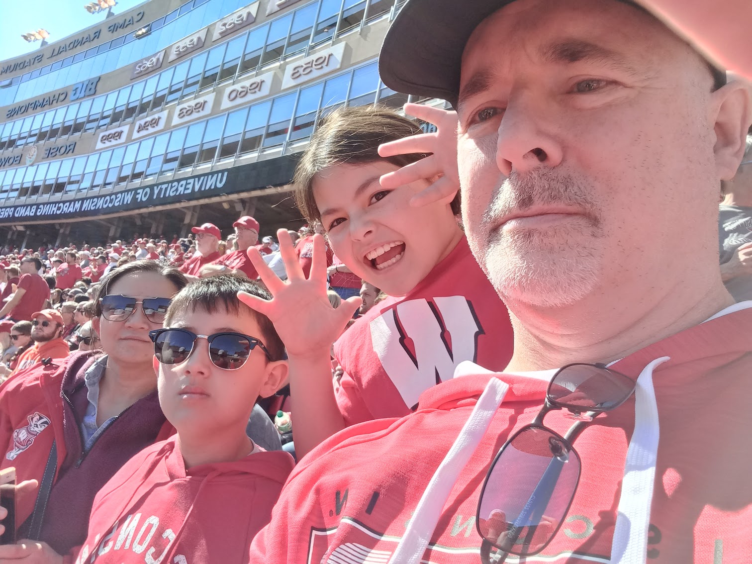 Bob Kuzoff with his wife Wenli and children Eli and Emma at a Wisconsin Badgers football game.