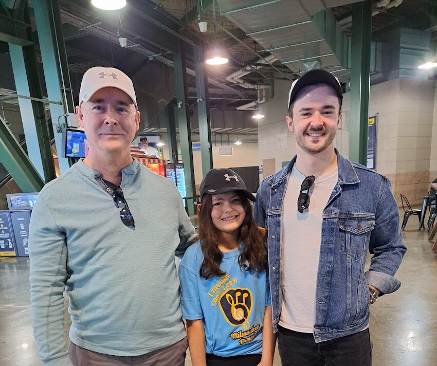 Bob Kuzoff with his children Emma and Nick at a Milwaukee Brewers baseball game.