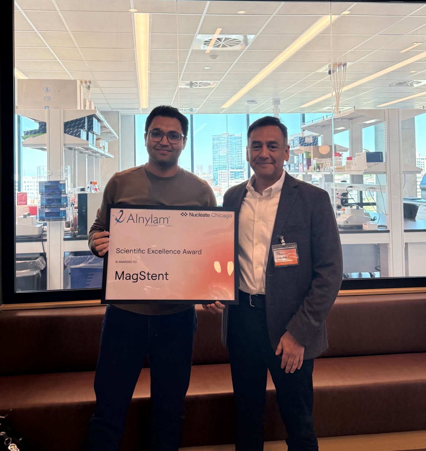 UW Applied Biotechnology student Paul Luna stands next to Ali Husnain, MD, a postdoctoral researcher and medical resident at Northwestern University. The two received Nucleate Chicago's Scientific Excellence Award. 