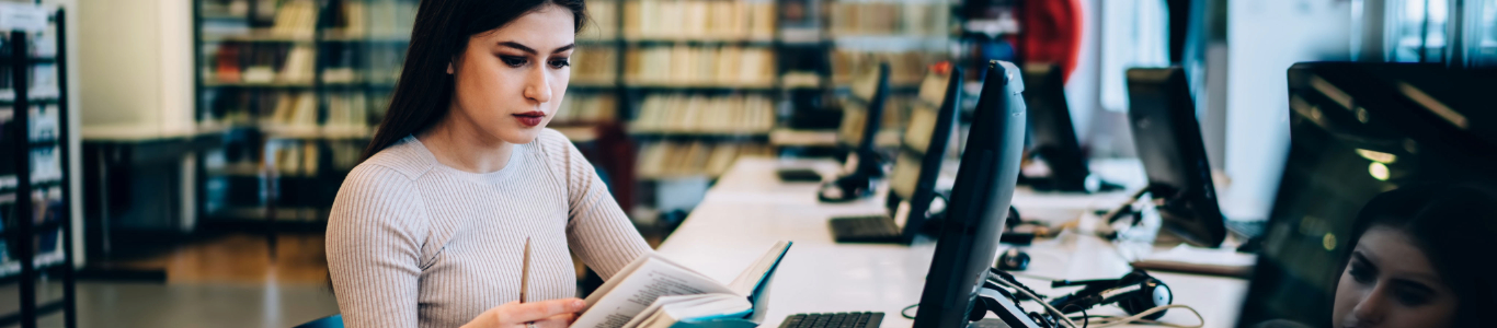 young woman studying in front of a computer