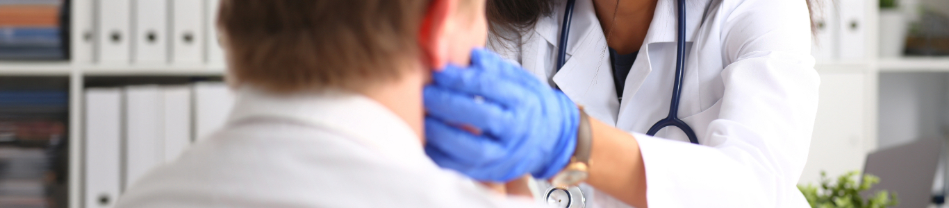 female medical professional feels a patient's lymph nodes